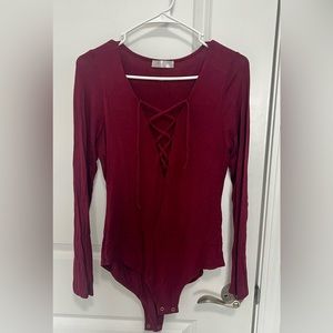 Woman’s long sleeve body suit size small
